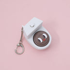 Quirky Toilet Poop Pop-Up Clicker Keychain - Fun Gag Gift & Desk Decor Toy