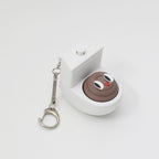 Quirky Toilet Poop Pop-Up Clicker Keychain - Fun Gag Gift & Desk Decor Toy