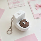 Quirky Toilet Poop Pop-Up Clicker Keychain - Fun Gag Gift & Desk Decor Toy